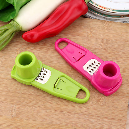 Manual garlic press and seasoning grinder