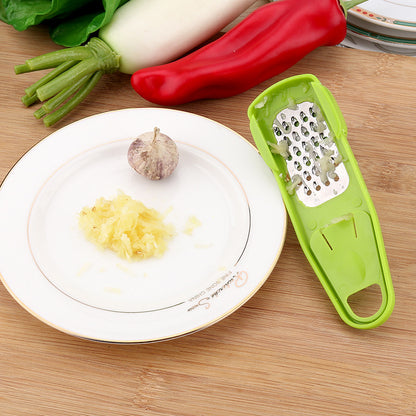 Manual garlic press and seasoning grinder