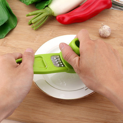 Manual garlic press and seasoning grinder