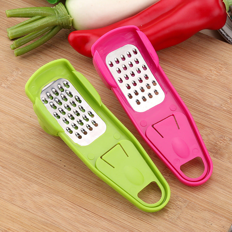 Manual garlic press and seasoning grinder