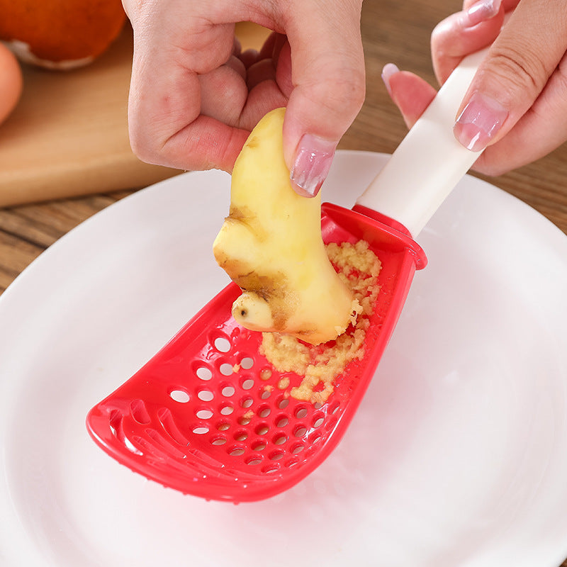 Multifunctional slotted cooking spoon and masher