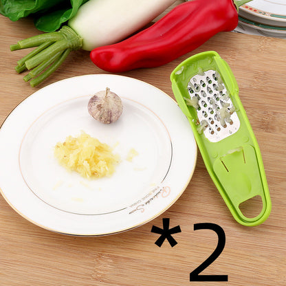Manual garlic press and seasoning grinder