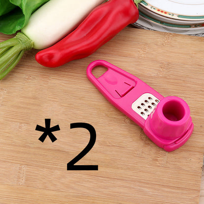 Manual garlic press and seasoning grinder